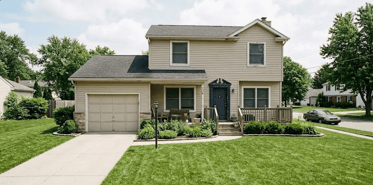 Freshly mowed lawn with clean edges after weekly maintenance