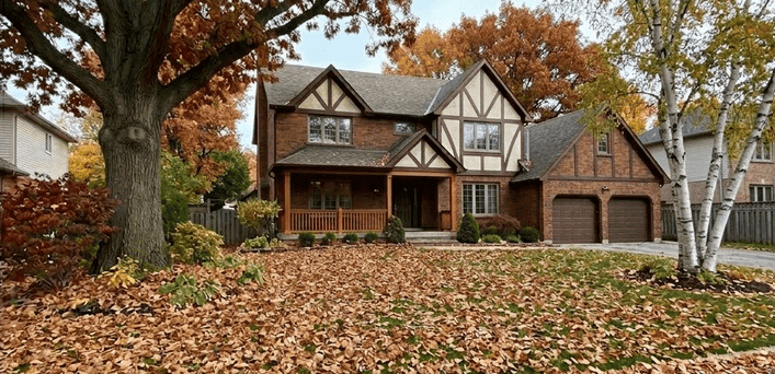 Lawn covered in fallen leaves before leaf removal