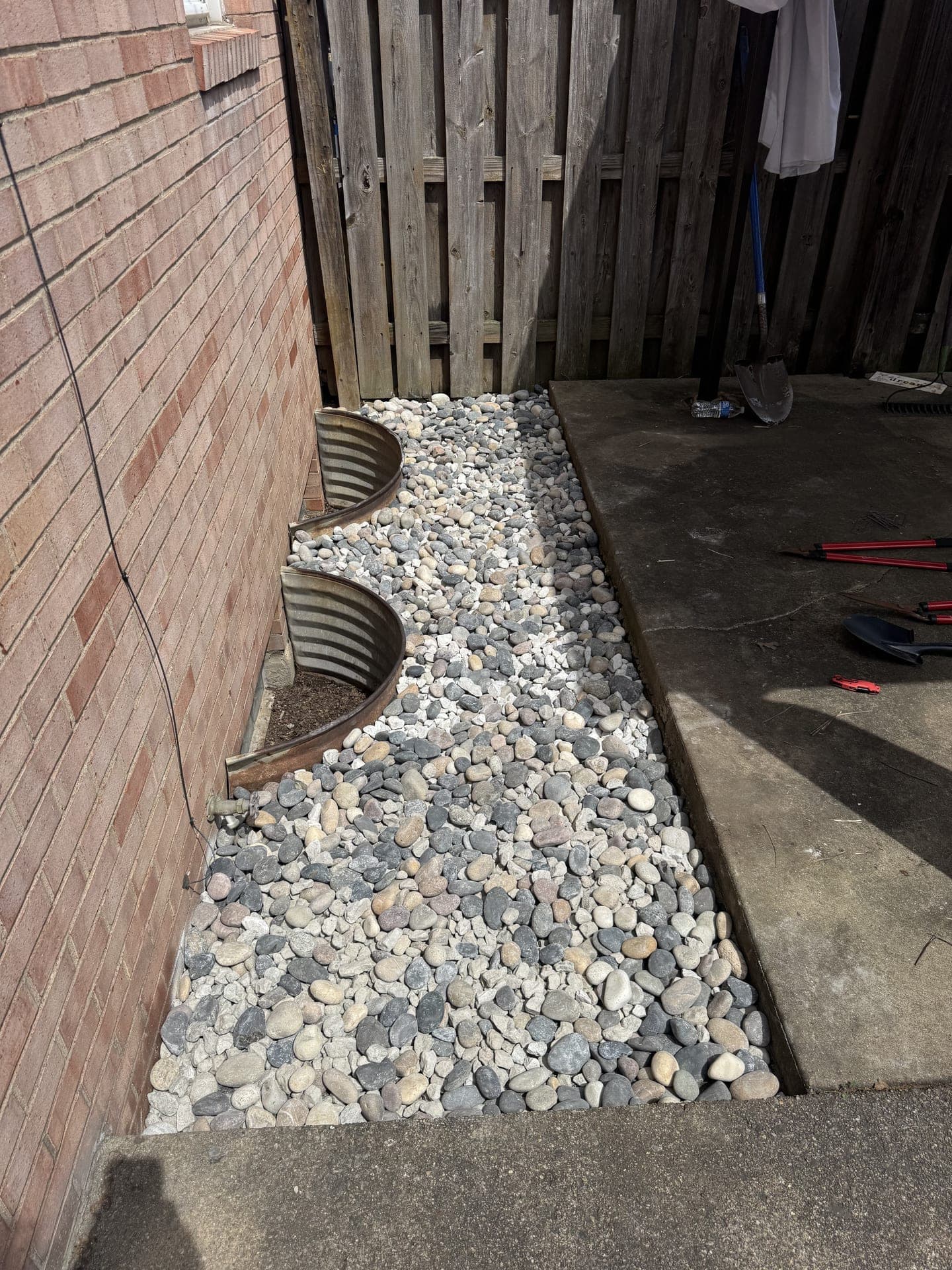Stone landscape bed after cleanup