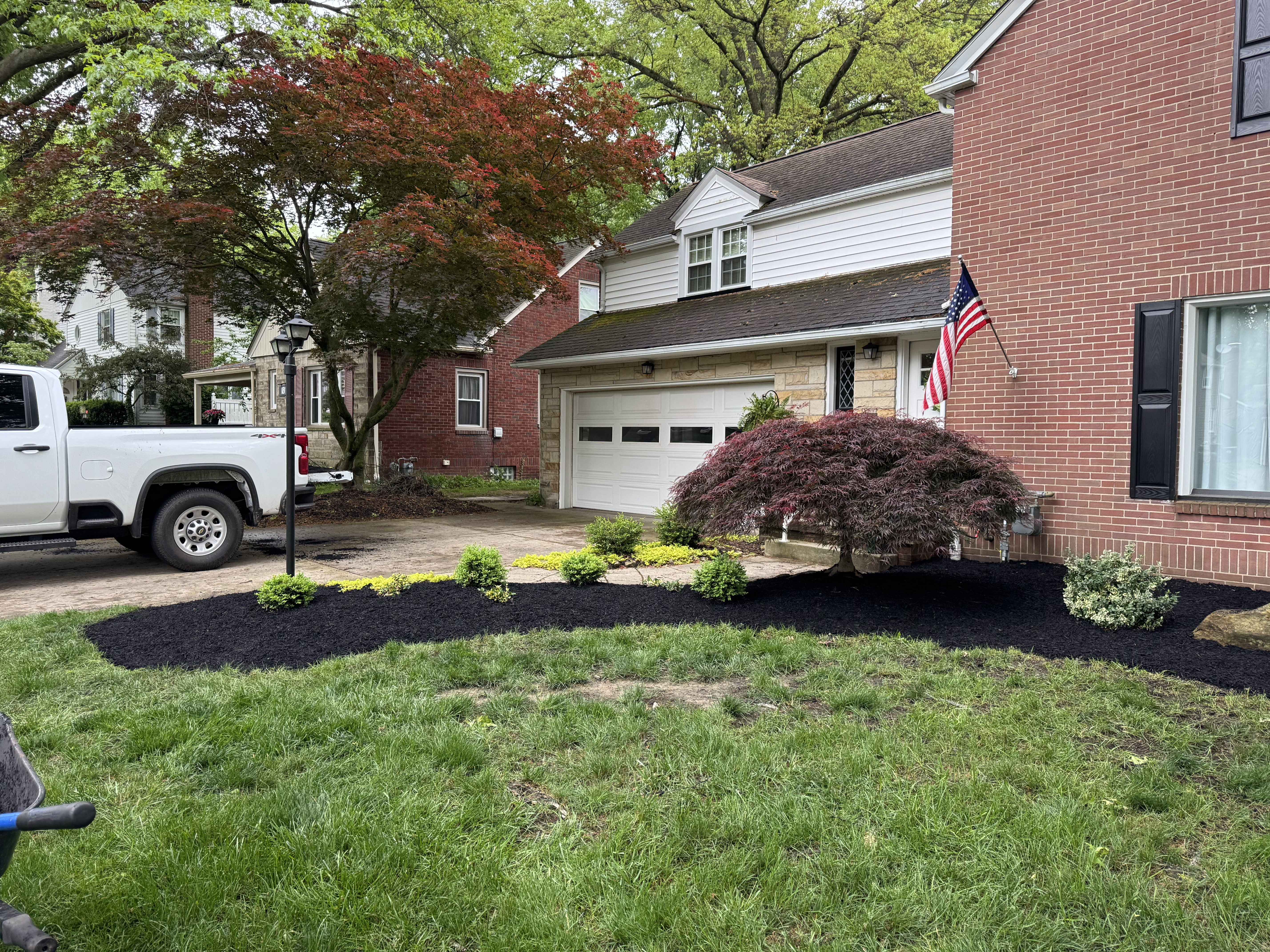 New mulch around shrubs after landscaping service