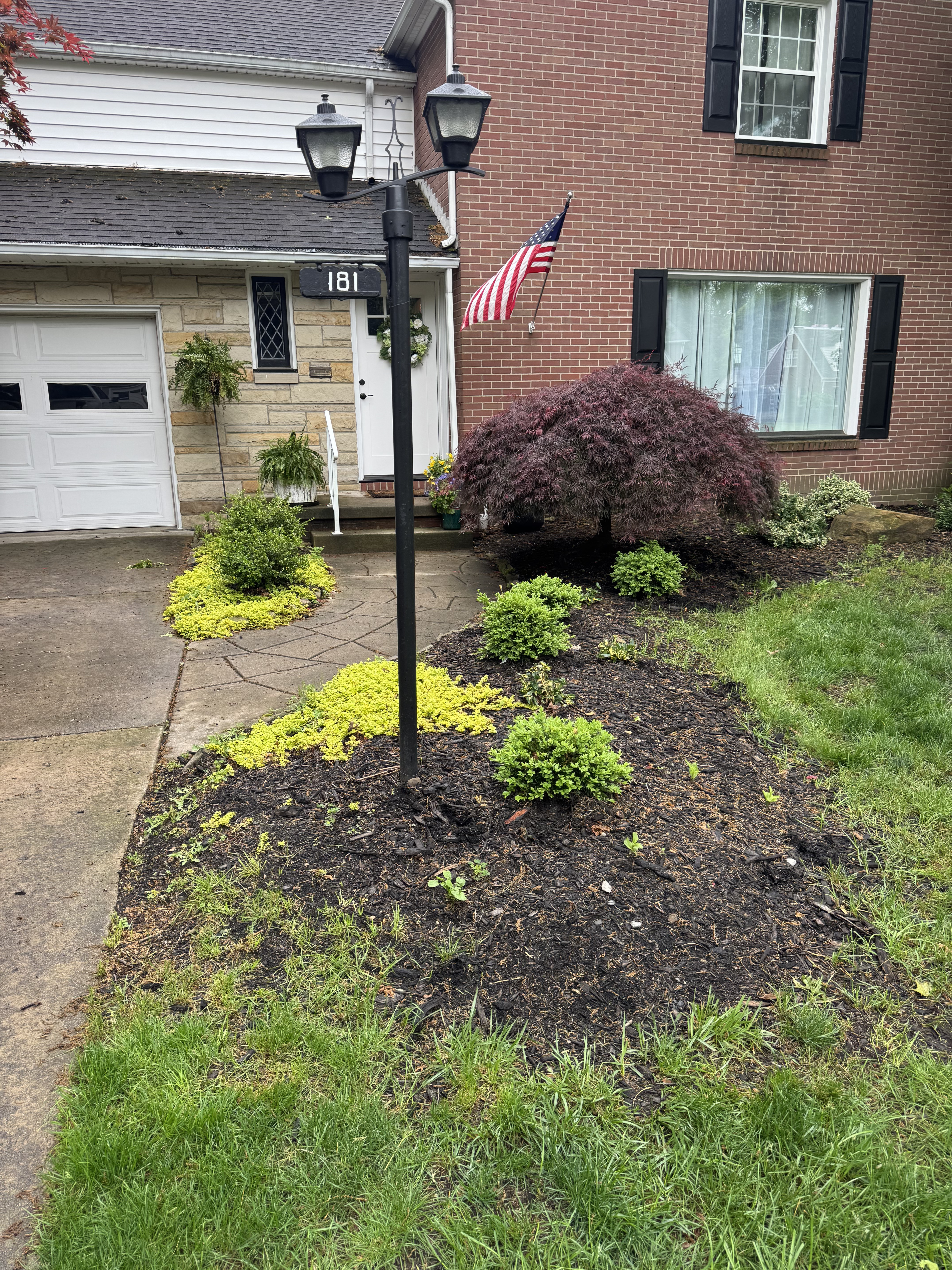 Faded mulch beds before refresh