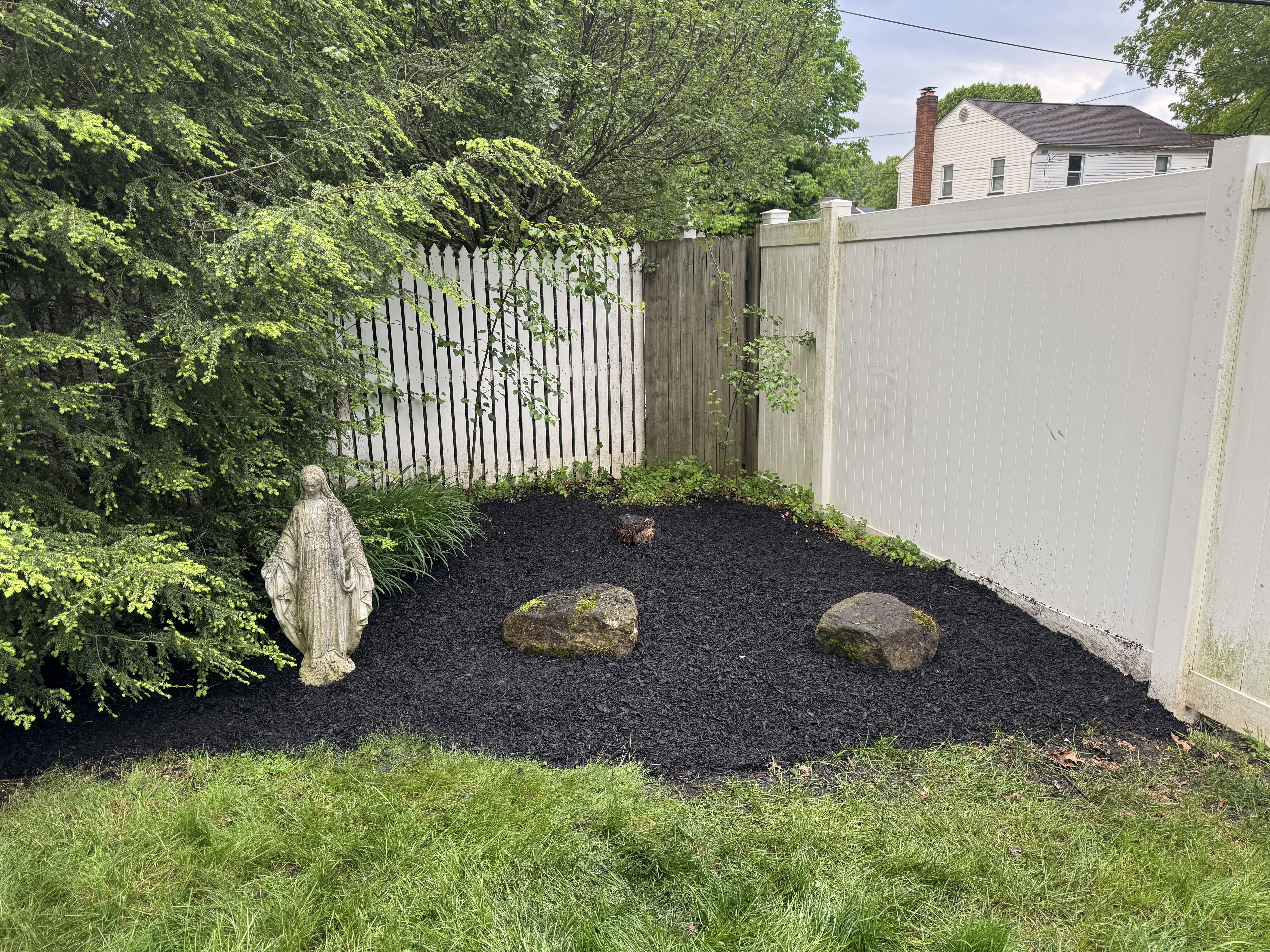 Tidy landscape bed after Porter Property Brothers cleanup
